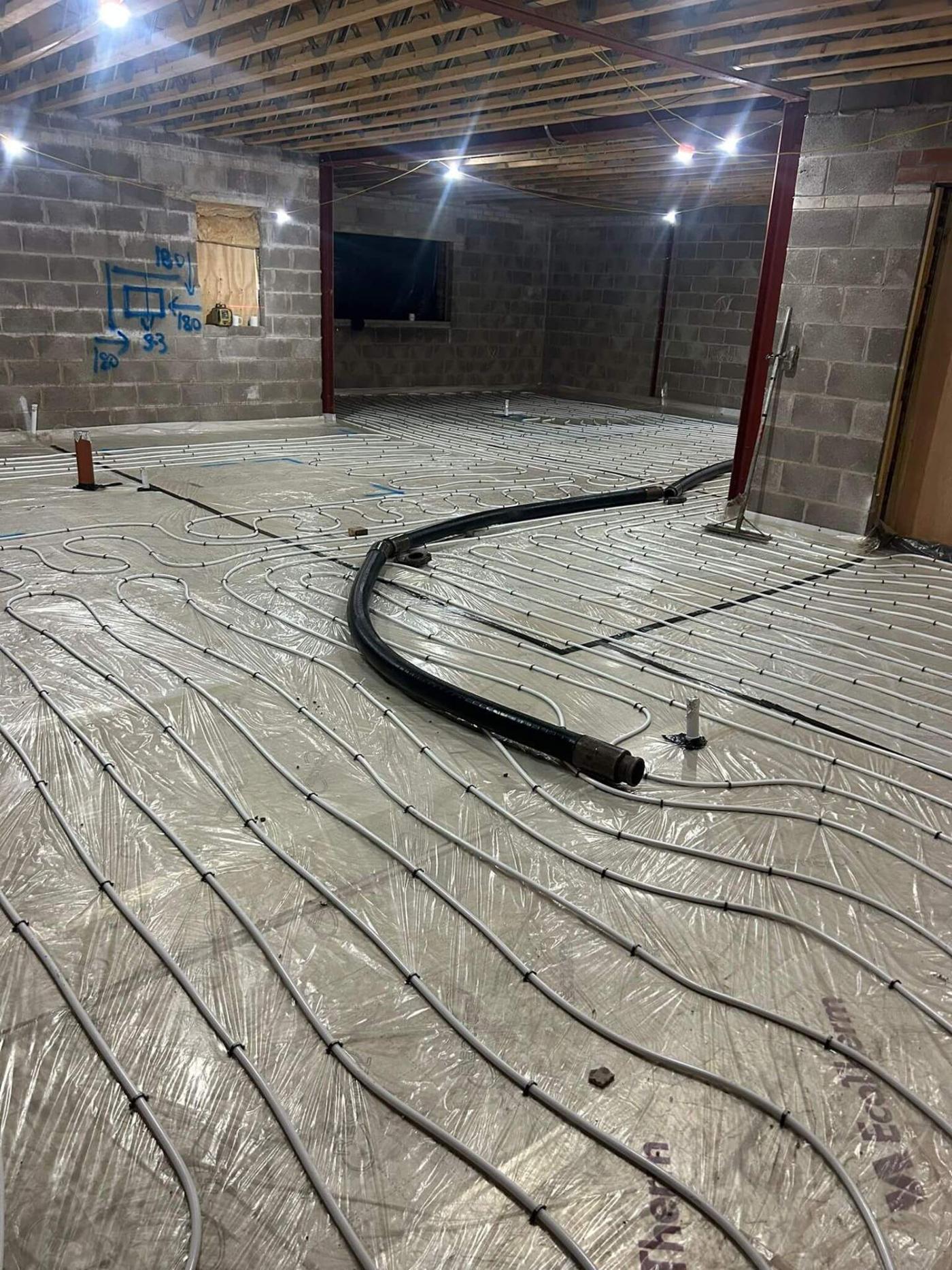 Underfloor heating pipes laid out and ready for a liquid screed pour